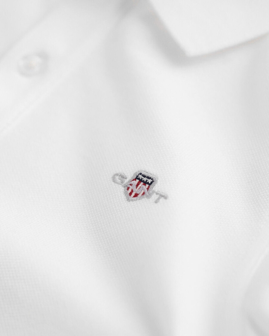 polo de piqué con escudo para niños - blanco