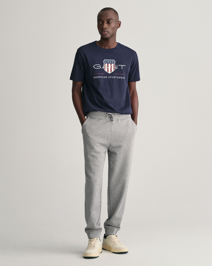 pantalones deportivos shield - gris jaspeado