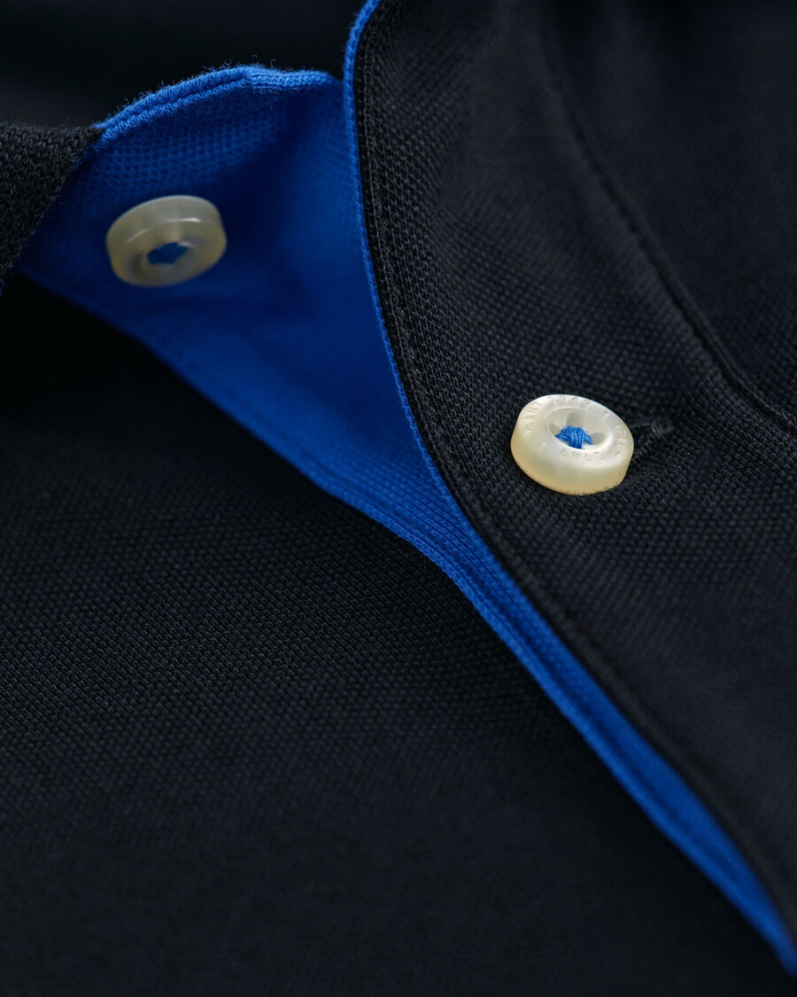 polo de piqué en contraste - negro