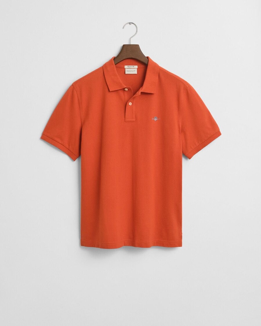 polo de piqué shield de corte regular - naranja intenso